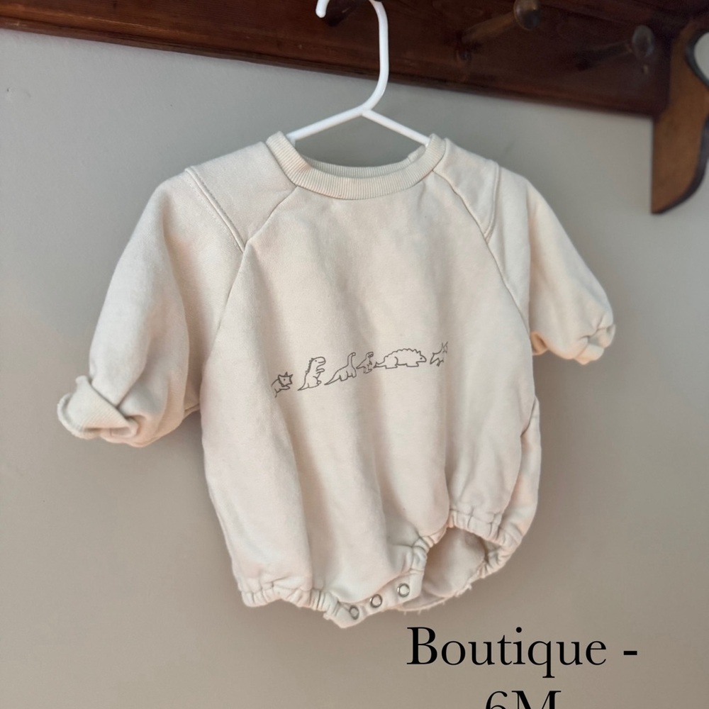 Cream Baby Onesie with Dinosaur Design